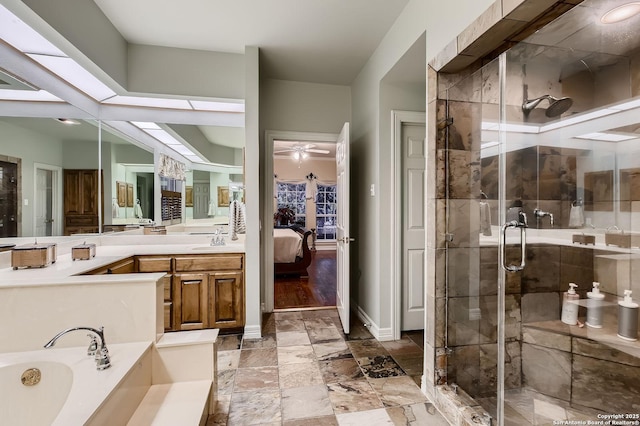 409 Sandy Oaks, Boerne, TX 78015 - ensuite bathroom with connected bathroom, vanity, a ceiling fan, a shower stall, and a garden tub