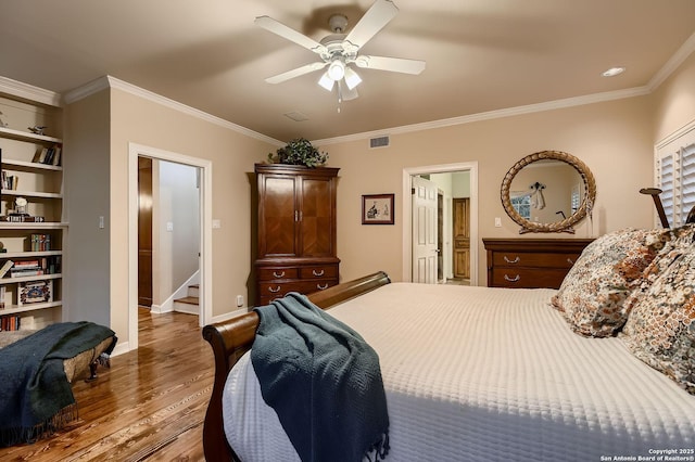 409 Sandy Oaks, Boerne, TX 78015 - bedroom featuring a ceiling fan, wood finished floors, baseboards, visible vents, and ornamental molding