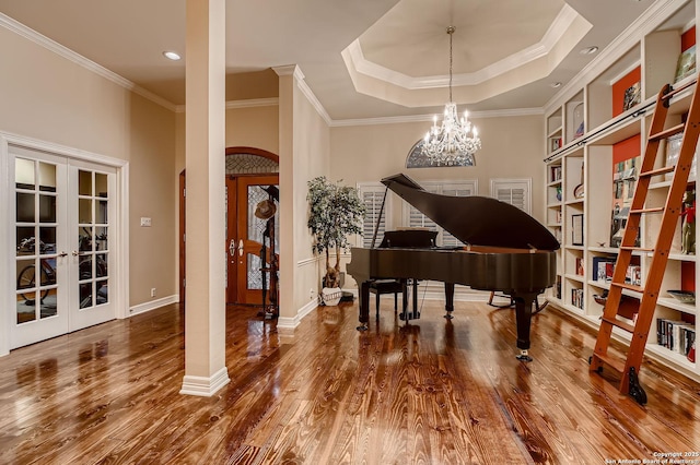 409 Sandy Oaks, Boerne, TX 78015 - living area featuring arched walkways, wood finished floors, french doors, and crown molding