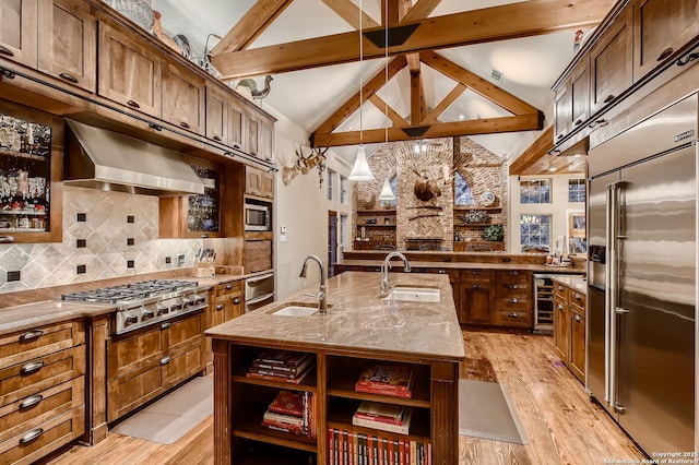 409 Sandy Oaks, Boerne, TX 78015 - kitchen with ventilation hood, a sink, built in appliances, and open shelves