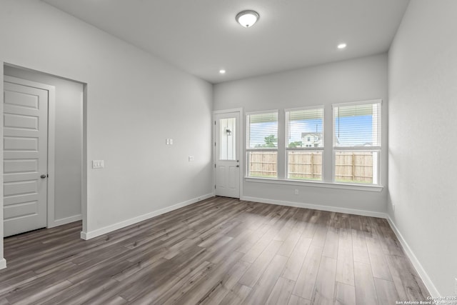 1509 Passmore Downs, New Braunfels, TX 78130 - unfurnished room with wood finished floors, baseboards, and recessed lighting