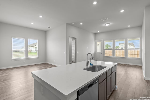 1509 Passmore Downs, New Braunfels, TX 78130 - kitchen with dishwasher, a sink, light wood finished floors, an island with sink, and recessed lighting