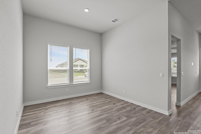 1509 Passmore Downs, New Braunfels, TX 78130 - spare room with wood finished floors, baseboards, and recessed lighting