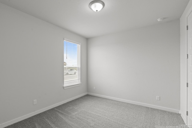 1509 Passmore Downs, New Braunfels, TX 78130 - carpeted empty room featuring baseboards and a smoke detector
