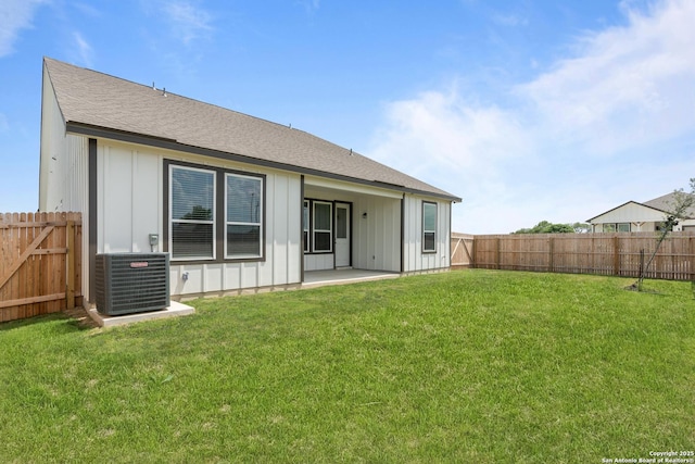 1509 Passmore Downs, New Braunfels, TX 78130 - back of property featuring central AC, board and batten siding, a patio, and roof with shingles