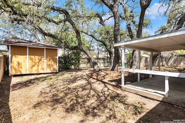 5435 Vista Trl, San Antonio, TX 78247 - view of yard featuring an outdoor structure, a fenced backyard, and a shed