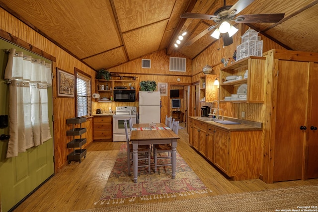 kitchen featuring open shelves, wooden walls, visible vents, vaulted ceiling with beams, and white appliances