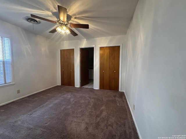 430 Anton, San Antonio, TX 78223 - unfurnished bedroom with carpet flooring, a ceiling fan, multiple closets, baseboards, and visible vents