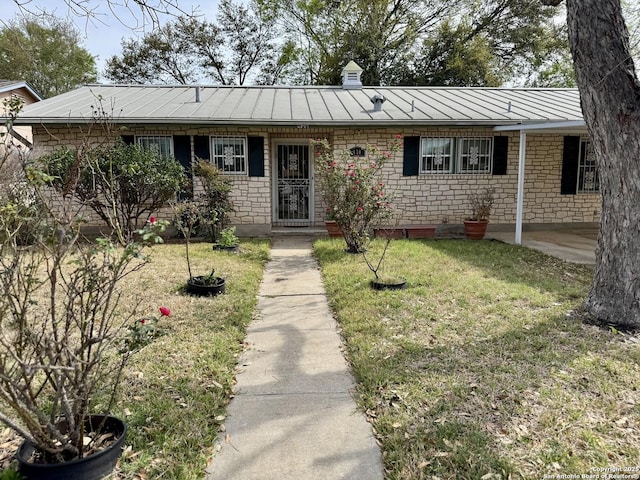 430 Anton, San Antonio, TX 78223 - ranch-style house with metal roof, a standing seam roof, and a front lawn