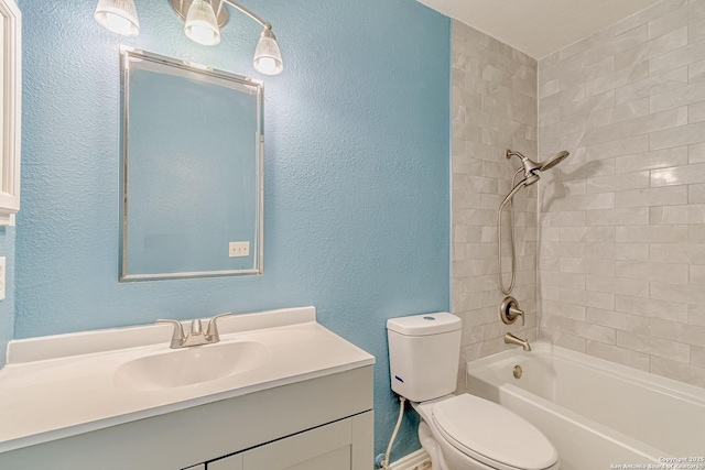 full bath featuring a textured wall,  shower combination, toilet, and vanity