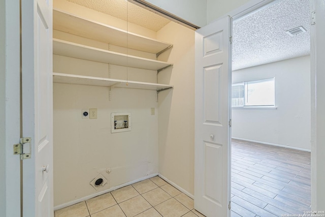 clothes washing area with visible vents, hookup for a gas dryer, hookup for a washing machine, laundry area, and electric dryer hookup