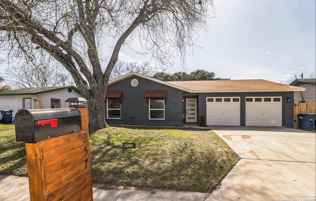 ranch-style house featuring a front yard, driveway, and a garage