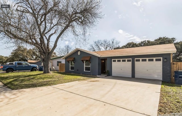 ranch-style home with a front yard, driveway, and a garage