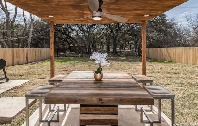 view of patio featuring a fenced backyard and a ceiling fan