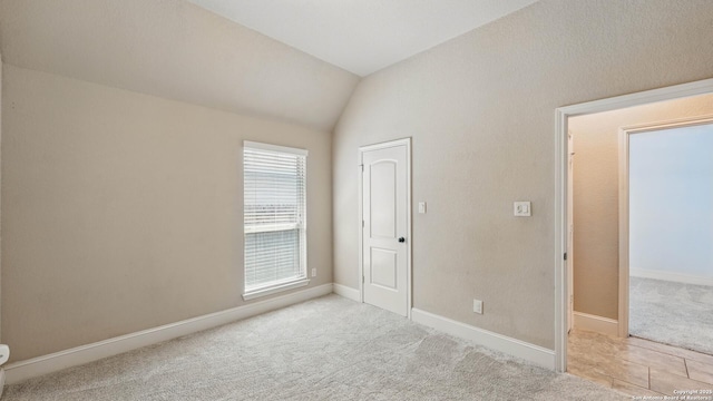 2144 Pioneer Pass, Seguin, TX 78155 - unfurnished bedroom with carpet flooring, vaulted ceiling, and baseboards