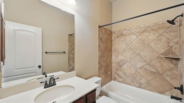 2144 Pioneer Pass, Seguin, TX 78155 - full bathroom with a textured wall, toilet, shower / bath combination, and vanity