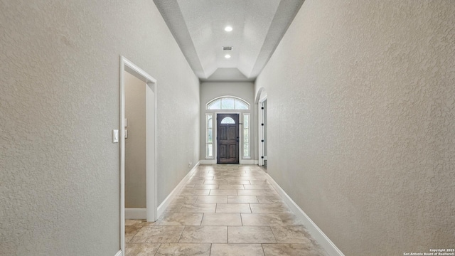 2144 Pioneer Pass, Seguin, TX 78155 - entryway with a textured wall, light tile patterned floors, and baseboards