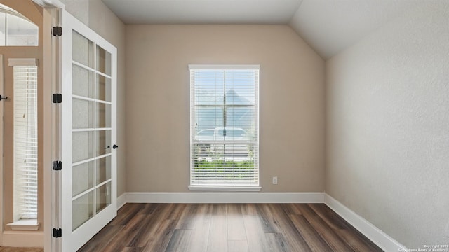 2144 Pioneer Pass, Seguin, TX 78155 - empty room featuring dark wood finished floors, french doors, baseboards, and lofted ceiling
