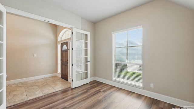2144 Pioneer Pass, Seguin, TX 78155 - entryway featuring healthy amount of natural light, wood finished floors, and french doors