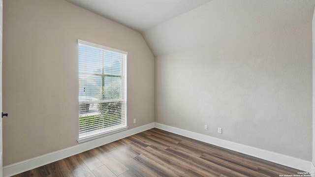 2144 Pioneer Pass, Seguin, TX 78155 - unfurnished room with baseboards, dark wood-style floors, and vaulted ceiling