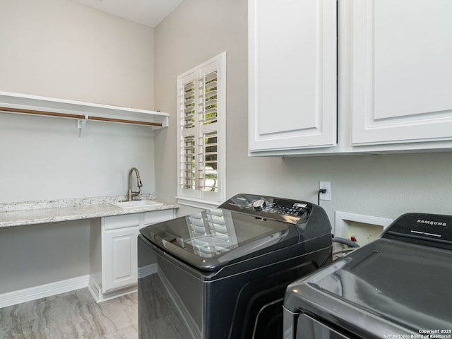 922 Split Fairway, San Antonio, TX 78260 - washroom with baseboards, marble finish floor, a sink, cabinet space, and washer and clothes dryer