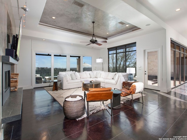 7110 Bella Rose, San Antonio, TX 78256 - living area featuring a tray ceiling, a wealth of natural light, and visible vents