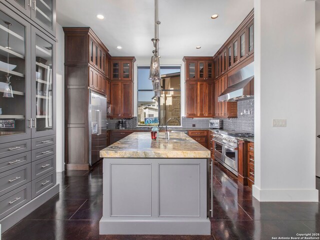 7110 Bella Rose, San Antonio, TX 78256 - kitchen featuring tasteful backsplash, a sink, light stone countertops, premium appliances, and wall chimney exhaust hood