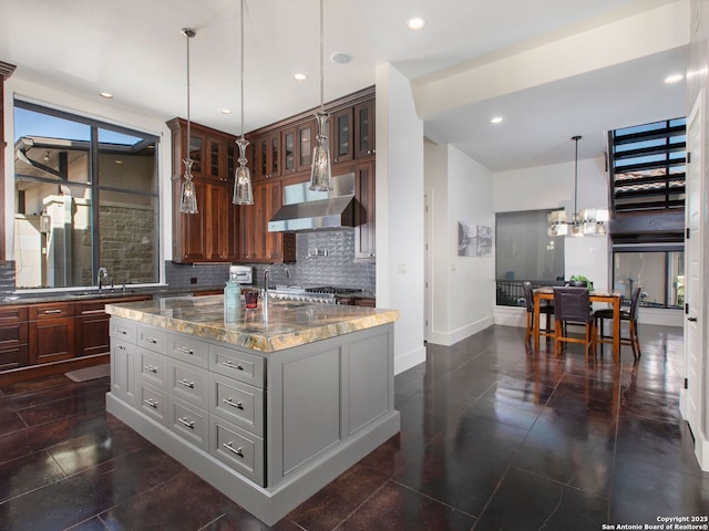 7110 Bella Rose, San Antonio, TX 78256 - kitchen with a sink, wall chimney exhaust hood, light stone countertops, glass insert cabinets, and decorative backsplash