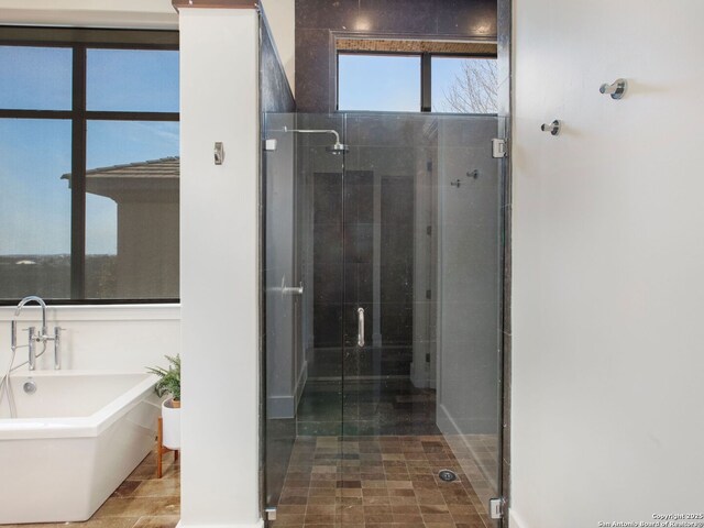 7110 Bella Rose, San Antonio, TX 78256 - bathroom featuring a soaking tub and a shower stall