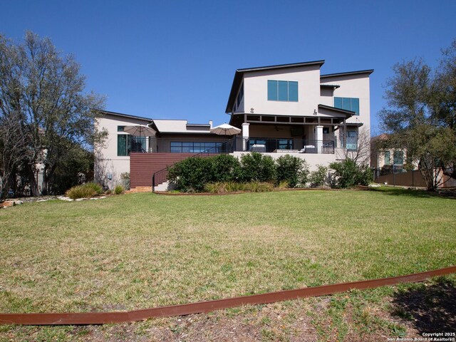 7110 Bella Rose, San Antonio, TX 78256 - rear view of house with a lawn and stucco siding