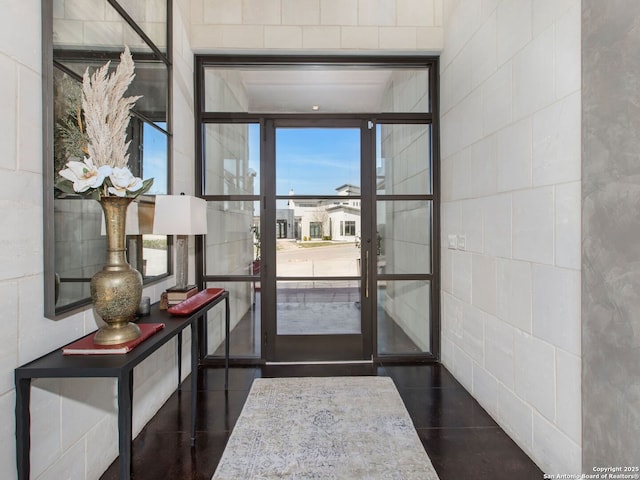 7110 Bella Rose, San Antonio, TX 78256 - foyer with dark tile patterned flooring and tile walls