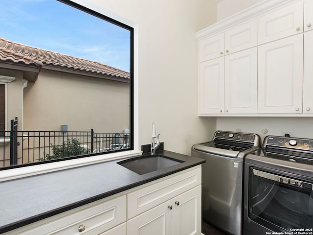 7110 Bella Rose, San Antonio, TX 78256 - laundry room featuring washing machine and clothes dryer, cabinet space, and a sink