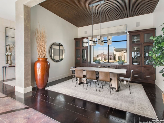 7110 Bella Rose, San Antonio, TX 78256 - dining area with baseboards, wooden ceiling, and a chandelier