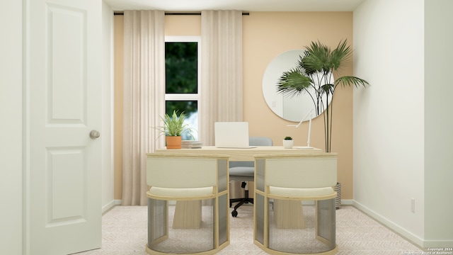 carpeted home office featuring baseboards