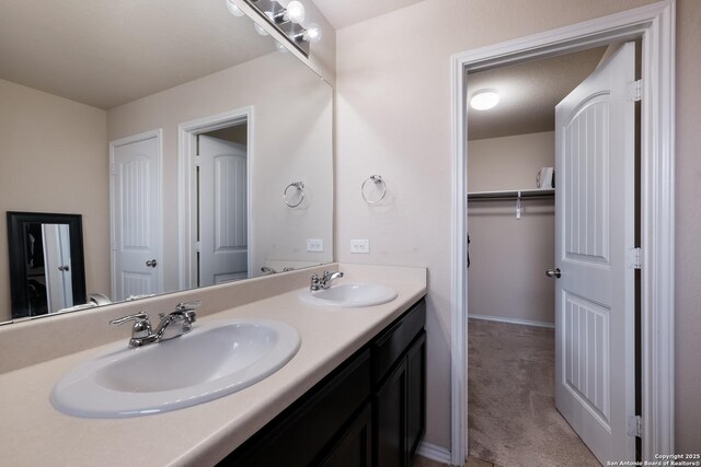bathroom featuring double vanity and a sink