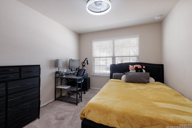 bedroom with light carpet