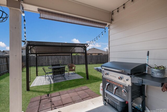 view of patio / terrace featuring a fenced backyard, a pergola, and a grill