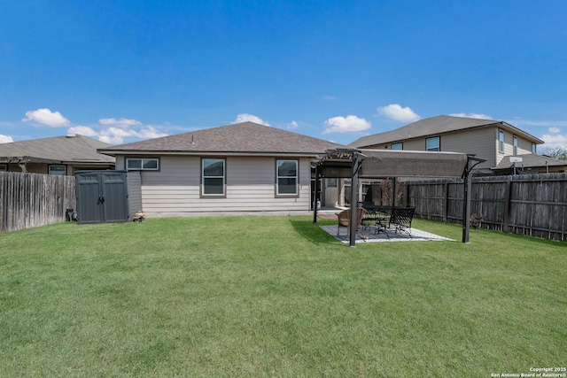 back of house with a patio area, an outbuilding, a storage shed, a fenced backyard, and a lawn