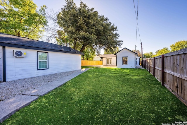 view of yard with an outbuilding and a fenced backyard