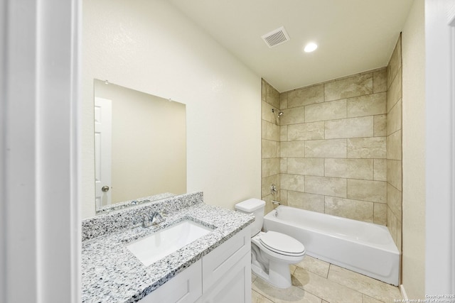 full bathroom featuring tile patterned flooring, vanity, toilet, visible vents, and washtub / shower combination