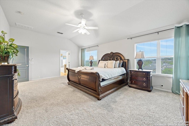 bedroom featuring light carpet, baseboards, vaulted ceiling, and a textured ceiling