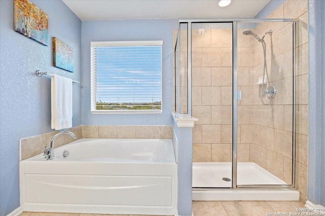 full bath featuring a bath and a shower stall