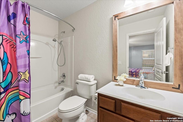 full bathroom featuring toilet, vanity, shower / bath combo, tile patterned flooring, and a textured wall