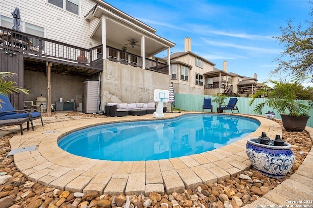 view of pool with an outdoor hangout area, fence, a patio, a fenced in pool, and ceiling fan