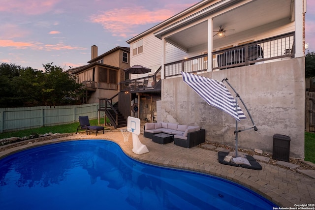 pool at dusk with stairs, a fenced in pool, fence, outdoor lounge area, and a patio