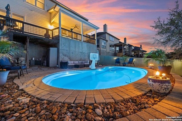 view of swimming pool featuring fence, a patio, and a fenced in pool