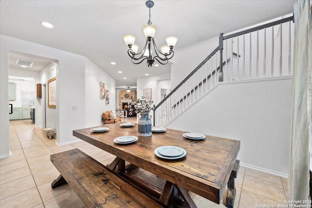 dining area with baseboards, stairway, light tile patterned floors, and a chandelier