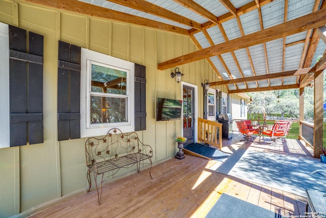 deck featuring grilling area and outdoor dining area
