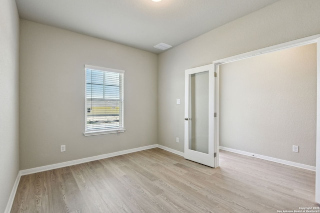 139 Perciful Ave, Cibolo, TX 78108 - unfurnished room with light wood finished floors, french doors, and baseboards
