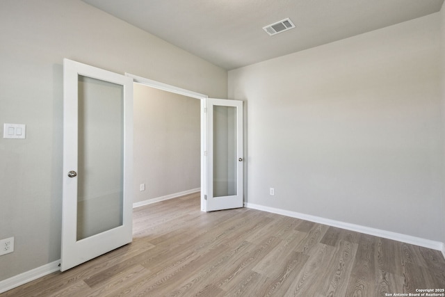 139 Perciful Ave, Cibolo, TX 78108 - unfurnished room with french doors, wood finished floors, and baseboards